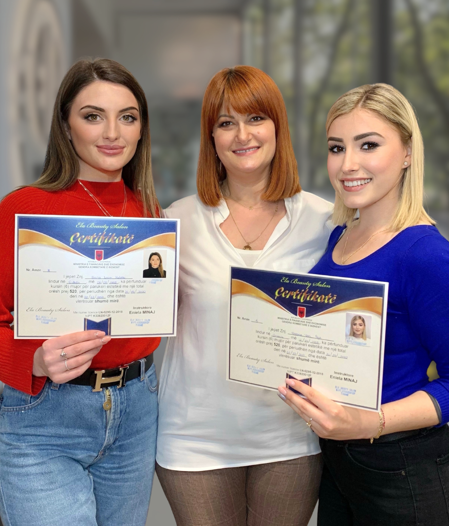 Three academy graduates with their instructor holding completion certificates