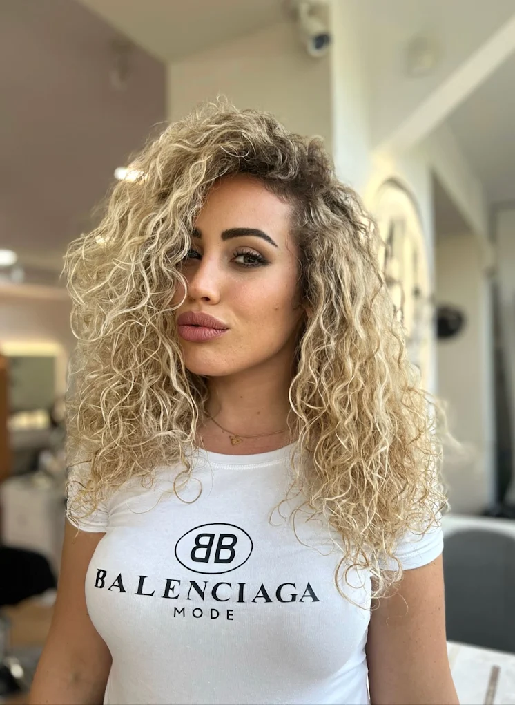 Curly blonde hair at Ela Beauty Salon