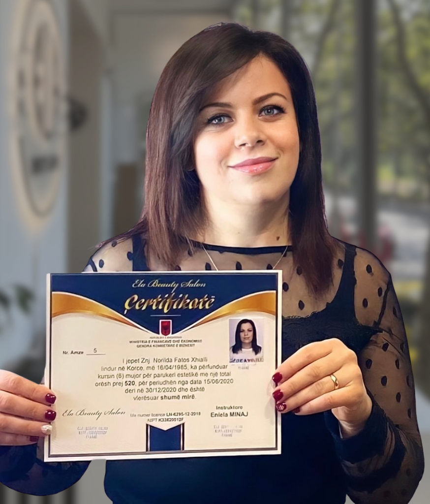 Academy graduate holding her completion certificate