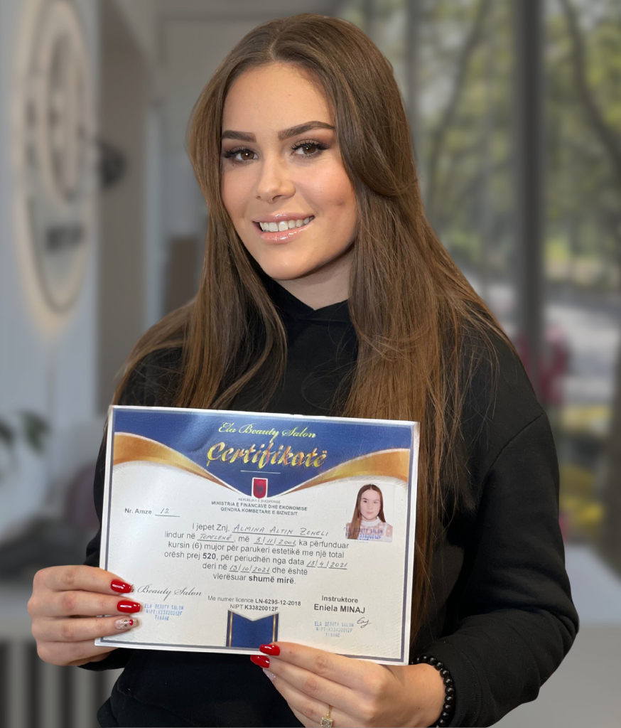 Academy graduate holding her completion certificate