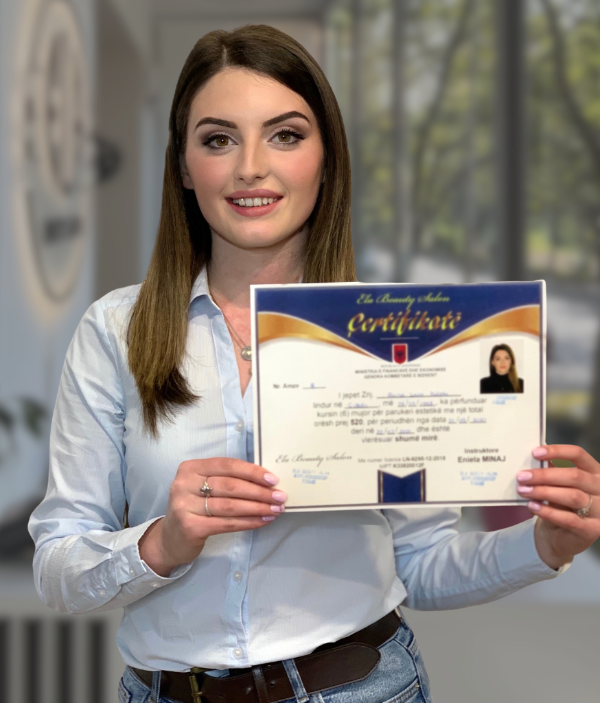 Academy graduate holding her completion certificate